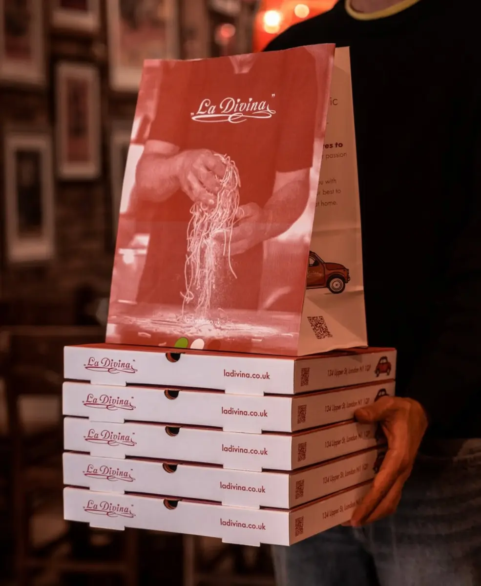 La Divina takeaway pizza boxes and branded pasta bag