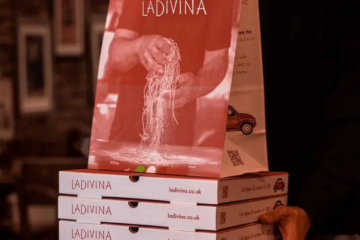 La Divina takeaway pizza boxes and branded pasta bag